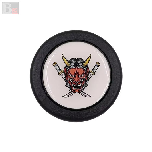 A black and red horn button with a white background featuring a red devil illustration in the center.