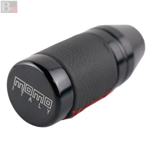 Black MOMO Italy car shift knob with size indicators on a white background